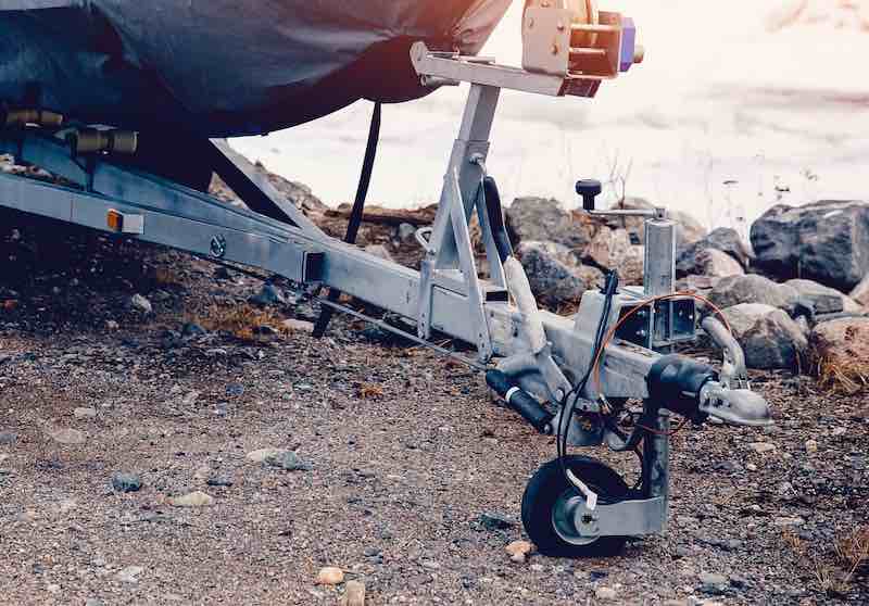 The tongue jack - or trailer jack - features a wheel at the base, which allows the boat trailer to be moved about to position it over the hitch ball.