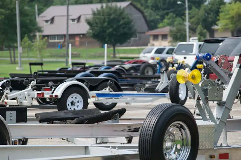 Boat trailers in a parking lot