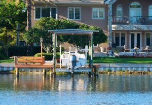 Boat lift by a lake house